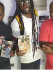 Artist holding press magazines